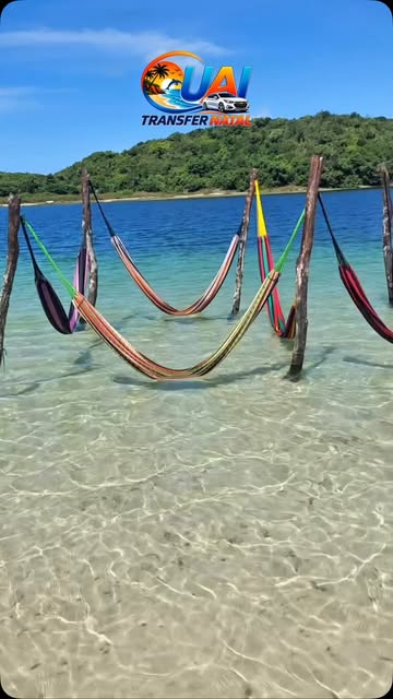 Hammocks over clear water — Uai Transfer Natal